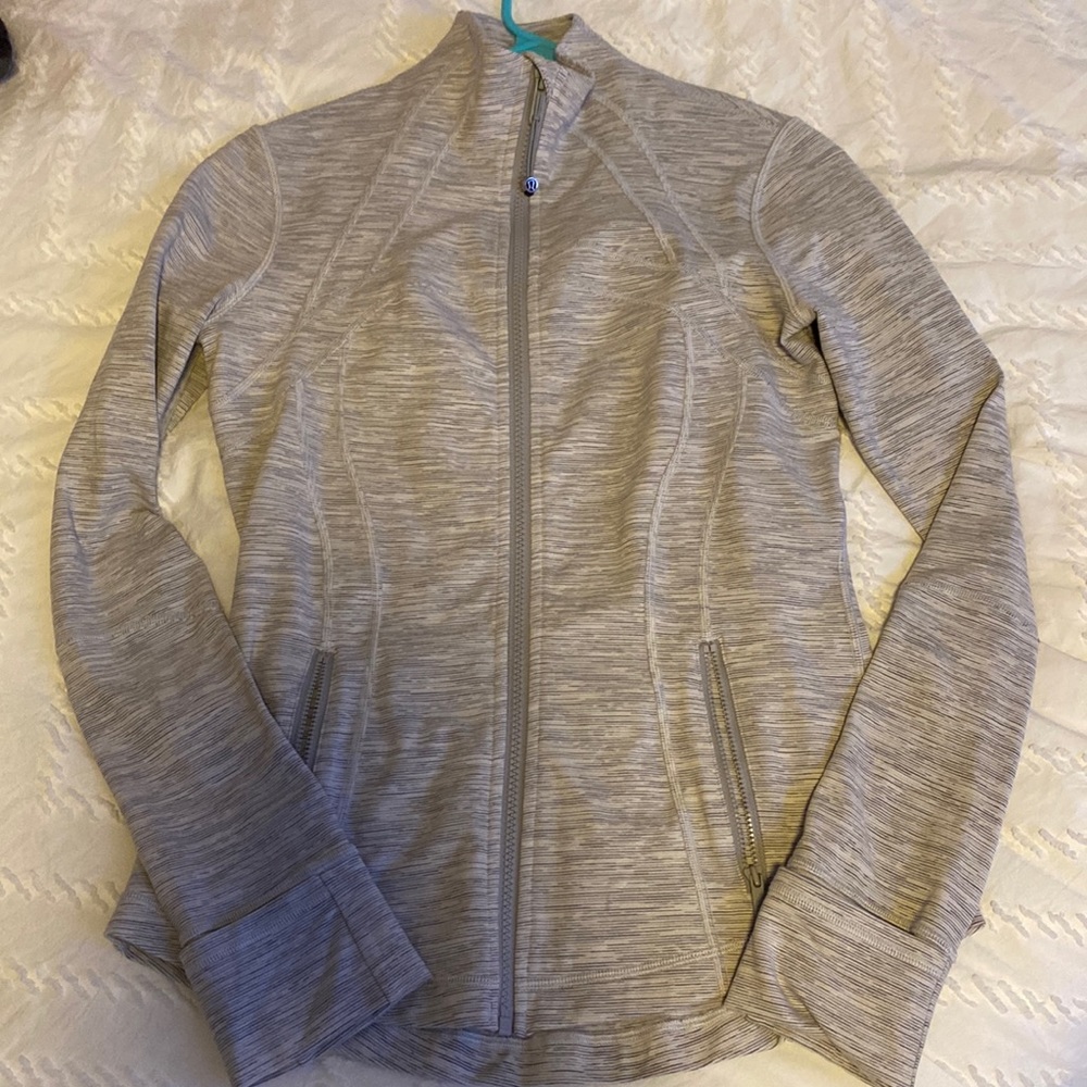 Grey lululemon define jacket. Doesn’t have tag, I would say around size 6.